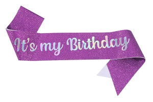 Detail of purple glitter birthday sash featuring holographic It's my Birthday text