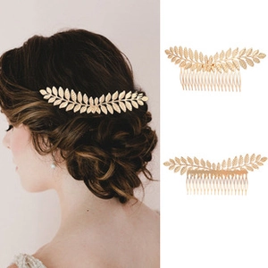 Detailed view of a gold leaf wedding hair comb showing intricate metal texture and fit