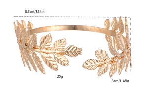 Detailed view of golden laurel leaf metal arm cuff with dimensions 8.5cm by 3cm
