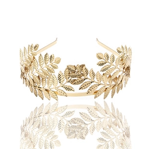 Detailed close-up of a golden leaf tiara with a polished metallic laurel design