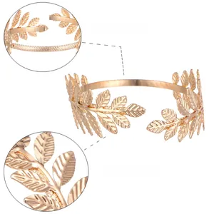 Detailed macro view of golden laurel leaf metal arm cuff showing intricate leaf vein textures