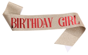 Detail of glitter fabric sash with shiny red Birthday Girl metallic lettering