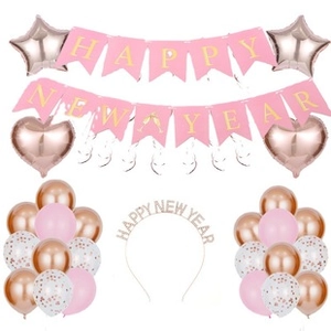 Rose gold Happy New Year party set with glitter banners balloons and festive headband