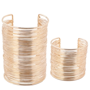 Detail view of gold layered wire-wrapped hollow wide cuff bracelets for women