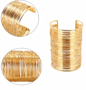 Detailed view of hand-wound gold wire texture on a wide open cuff bracelet for women