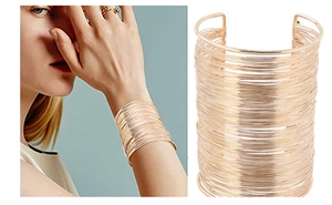 Detailed close-up showing the golden multi-layered wire wrap wide open bangle design