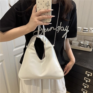Glossy white patent leather hobo bag with silver chain strap for summer casual wear