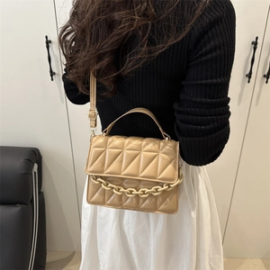 Quilted crossbody bag with acrylic chain and top handle in beige matte leather