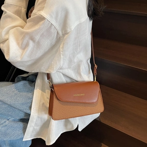 Chic brown patchwork crossbody bag with FASHION & BAGS lettering on minimalist flap