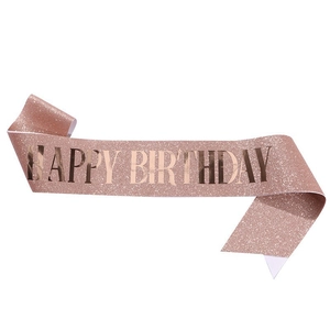 Glittering rose gold Happy Birthday party sash with shiny metallic foil lettering