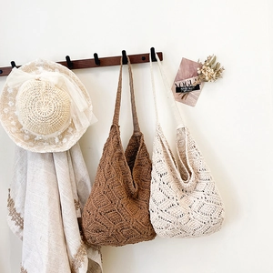 Handmade crochet tote bag with bohemian floral pattern for summer beach vacations
