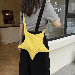 Star-shaped yellow crossbody bag with contrast black strap for casual 2025 trendy fashion
