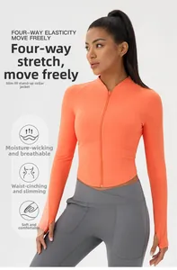 Detail of slim-fit orange yoga jacket with thumbhole sleeves and full zipper closure