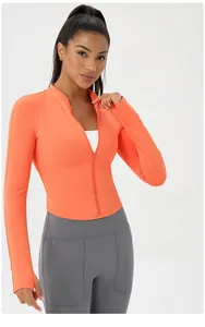 Detail of zip-up yoga jacket with stand collar and functional thumbhole cuffs