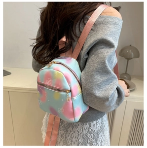 Detailed view of mini nylon backpack with colorful macaron tie-dye and love prints