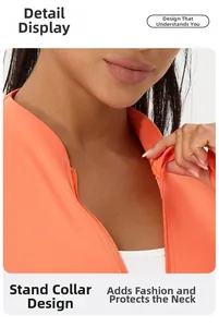 Close-up of bright orange yoga jacket with stand collar and smooth zipper detail