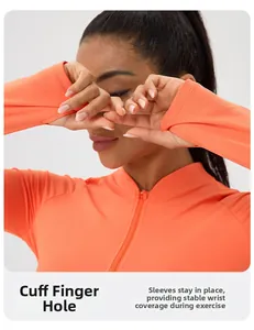 Detail of thumbholes on bright orange yoga jacket with high-elasticity quick-dry fabric