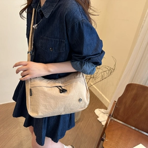Minimalist beige nylon crescent crossbody bag with double zippers and large capacity