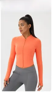 Detail of orange slim fit yoga jacket with stand collar and thumbhole sleeves