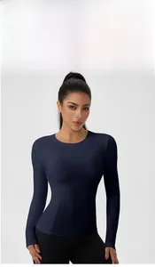 Detail of navy blue long sleeve yoga top featuring ergonomic seams and high elastic fabric