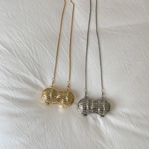 Chic gold and silver peanut pendants with white rhinestones on delicate metal chains