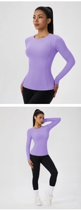 Close-up of lavender slim-fit yoga top featuring high-stretch fabric and crew neckline