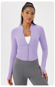 Close-up of lilac yoga jacket featuring a stand-up collar and functional thumbhole cuffs