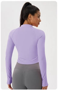 Rear view of slim fit cropped yoga jacket with high neck and raglan long sleeves