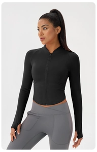 Detail of slim-fit yoga jacket with thumbholes and high-waist V-cross leggings