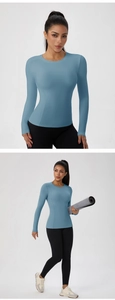 Detailed view of women's blue long-sleeve sports top with a slim fit and round neckline