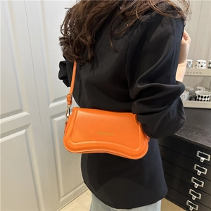 Minimalist orange PU leather shoulder bag with adjustable strap and golden logo detail