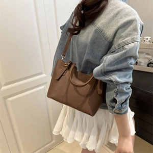 Brown lychee grain leather large capacity bucket bag with top handles and shoulder strap