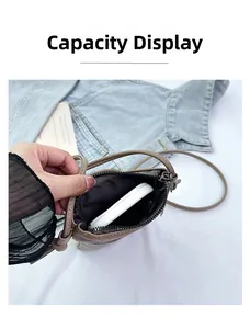 Internal view of brown litchi leather mini bag showing capacity for a power bank