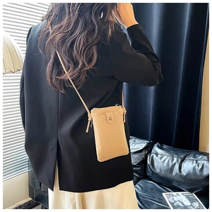 Vertical phone crossbody bag with litchi texture and front button pocket in light brown
