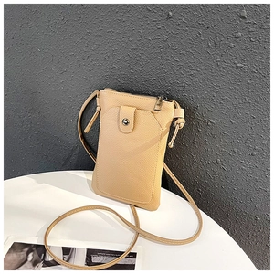 Detailed view of beige lychee leather crossbody phone bag with zipper and front flap pocket