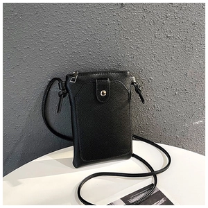 Detail of black litchi grain leather crossbody phone bag with silver zipper and buckle