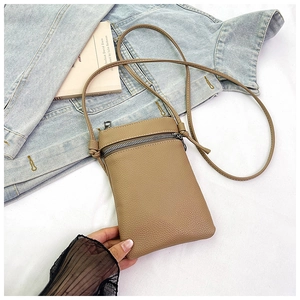 Close-up of khaki litchi grain leather mobile phone crossbody bag with zipper and strap