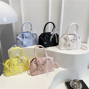 Chic women's handbags in multiple colors with lace bow details and long shoulder straps