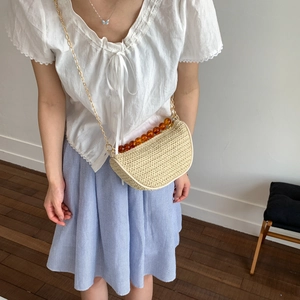 Summer crescent straw bag with amber bead handle and gold chain strap for women