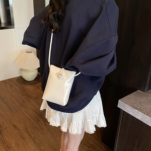 Chic white patent leather crossbody cell phone bag with elegant pearl clasp for women