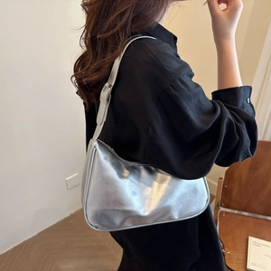 Metallic silver hobo shoulder bag with pleated texture and adjustable strap for women