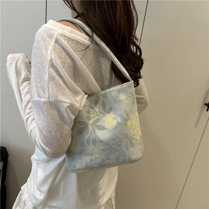 Schicke hellblaue Canvas-Beuteltasche für Damen mit elegantem gelbem Blumendruck