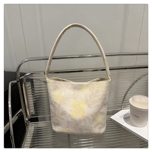Detail of elegant Chinese style bucket bag with floral embroidery and large capacity