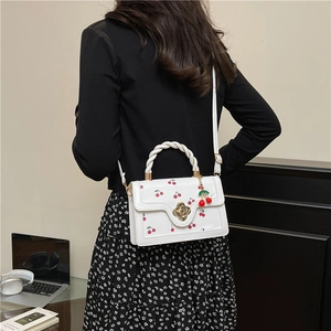 White cherry print handbag for women with gold floral clasp and woven handle