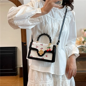 Fashionable cherry print mini square bag with golden flower buckle and black trim