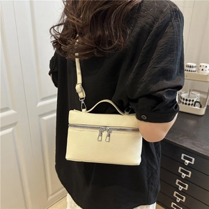 Fashionable cream-colored lychee leather mini square bag with silver zipper and shoulder strap