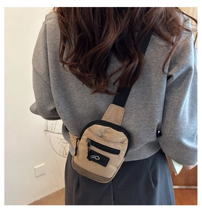 Rear view of a stylish khaki crossbody chest bag worn for daily casual use
