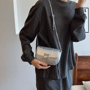 Chic silver quilted crossbody bag with adjustable gold-ball chain strap and U-shaped buckle