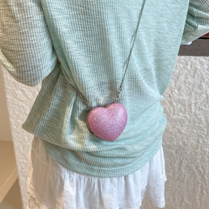 Pink glitter heart-shaped mini crossbody bag with silver chain strap for young women