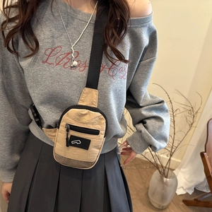 Contrast nylon crossbody bag in khaki featuring front zipper pocket and adjustable strap